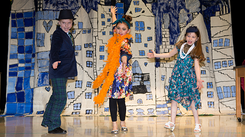 Students performing on stage